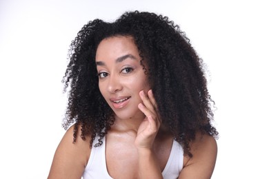 Photo of Beautiful Brazilian woman with healthy skin on white background