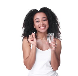 Photo of Beautiful Brazilian woman with glass of water and collagen pill on white background