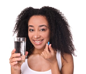 Photo of Beautiful Brazilian woman with glass of water and collagen pill on white background