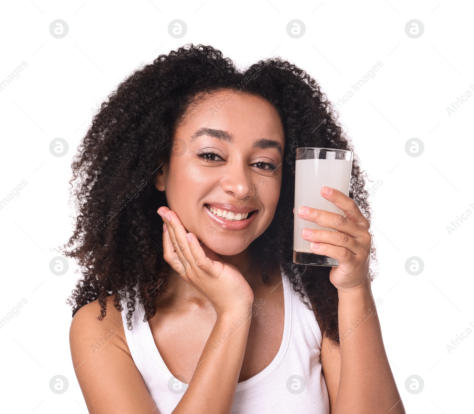 Beautiful Brazilian woman with glass of collagen water on white background Photo of Beautiful Brazilian woman with glass of collagen water on white background