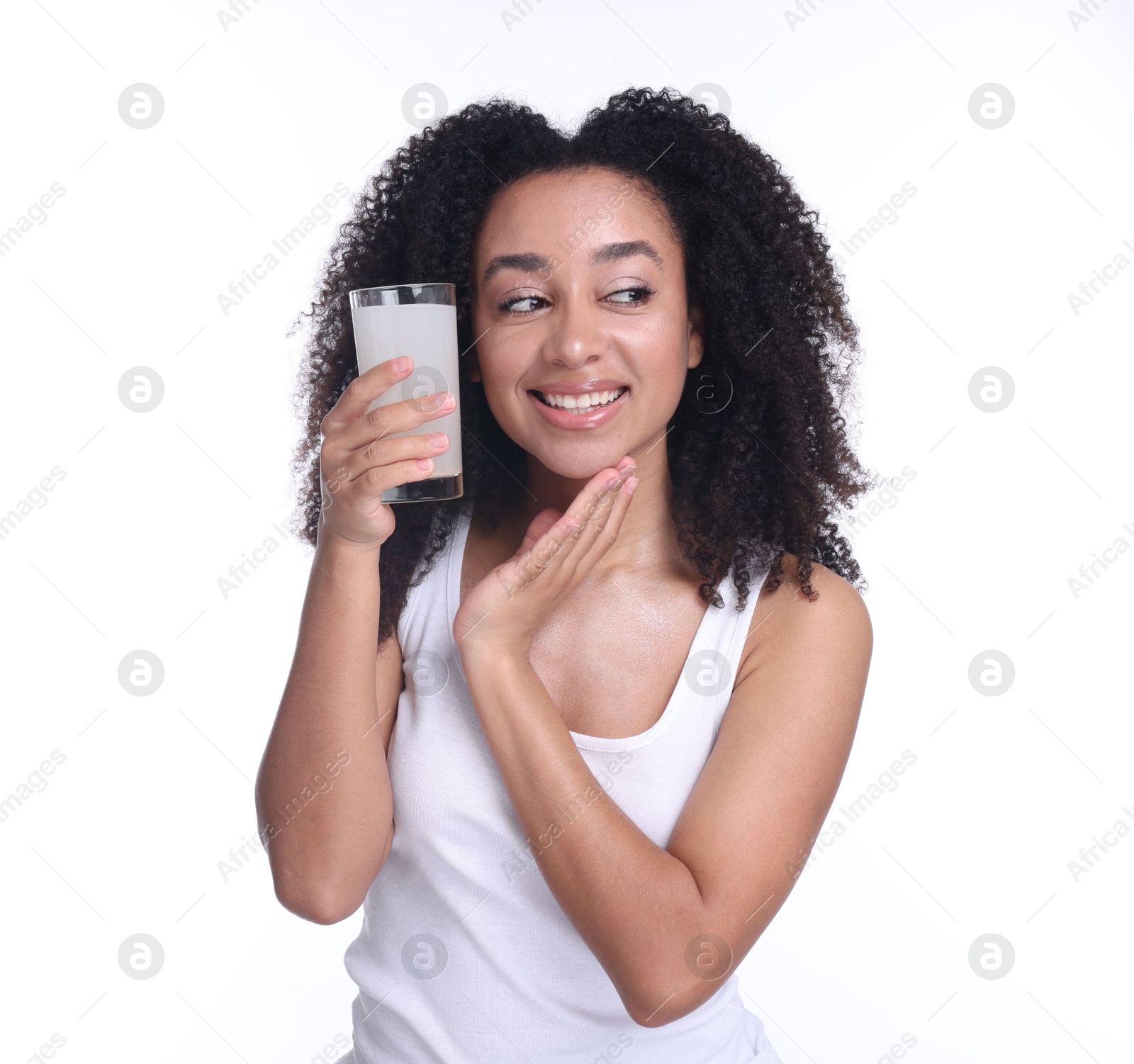 Beautiful Brazilian woman with glass of collagen water on white background Photo of Beautiful Brazilian woman with glass of collagen water on white background