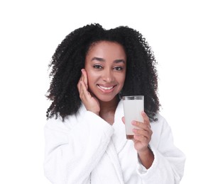 Photo of Beautiful Brazilian woman with glass of collagen water on white background