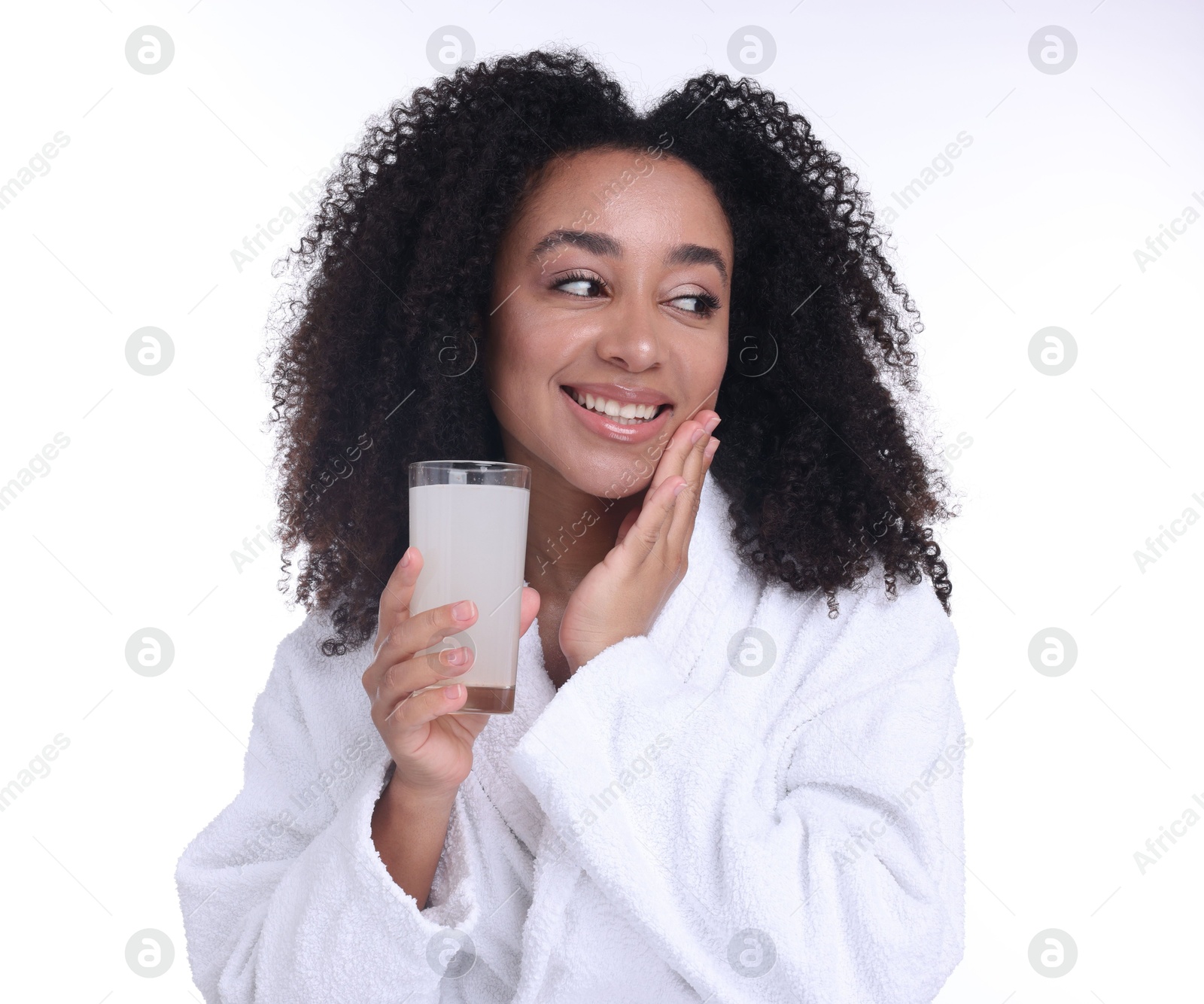 Beautiful Brazilian woman with glass of collagen water on white background Photo of Beautiful Brazilian woman with glass of collagen water on white background