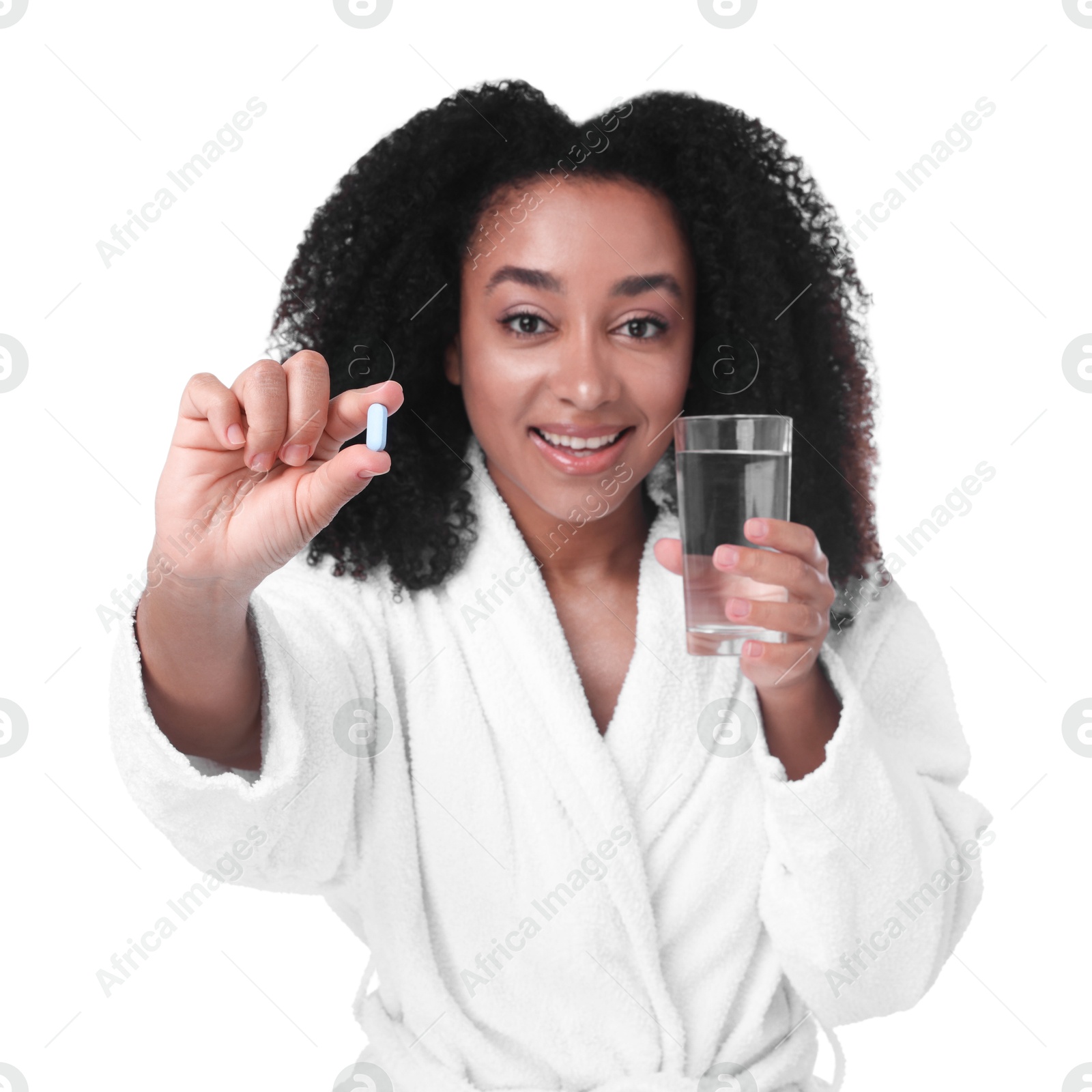 Beautiful Brazilian woman with glass of water and collagen pill on white background Photo of Beautiful Brazilian woman with glass of water and collagen pill on white background
