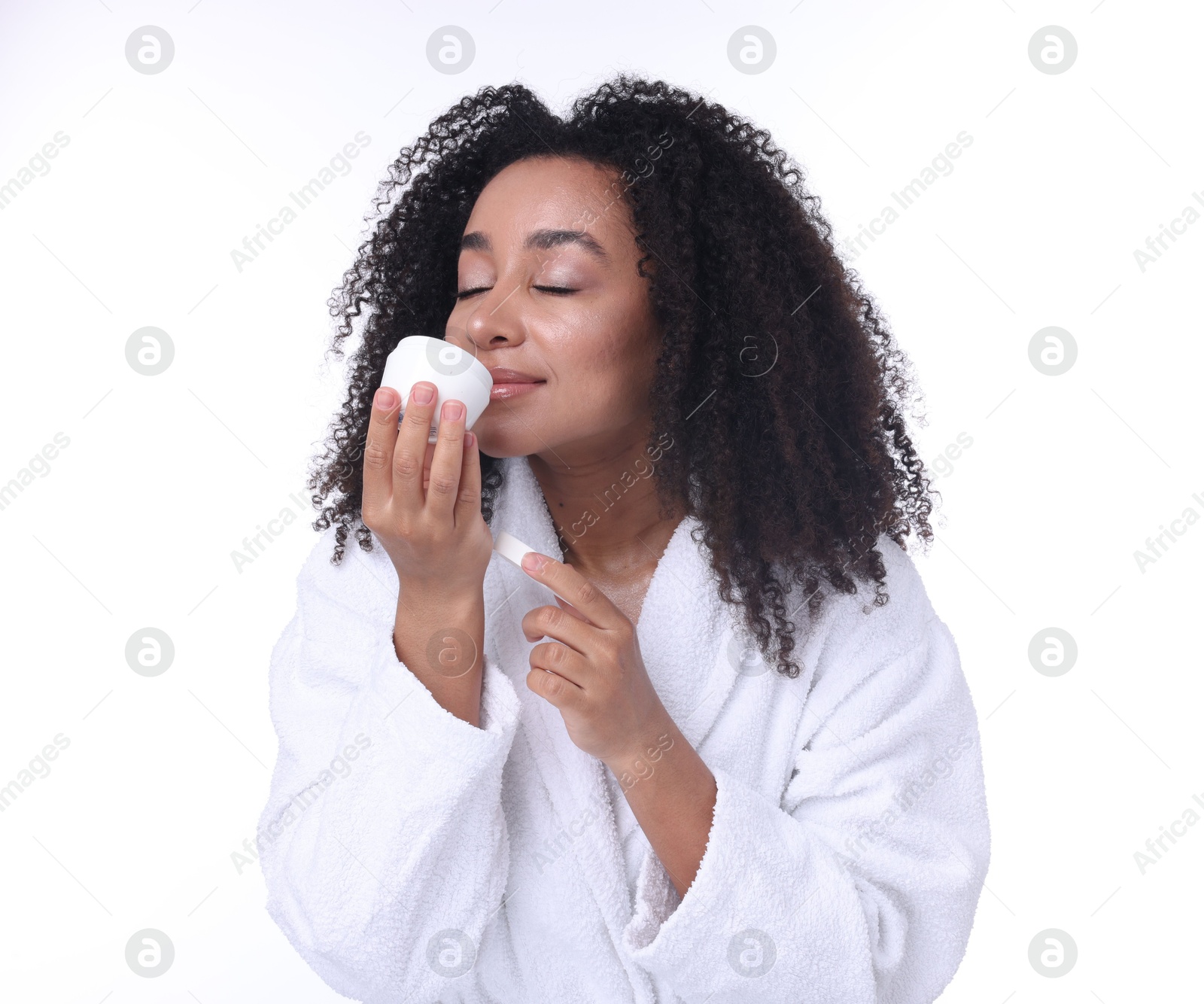 Beautiful Brazilian woman with jar of collagen cream on white background Photo of Beautiful Brazilian woman with jar of collagen cream on white background