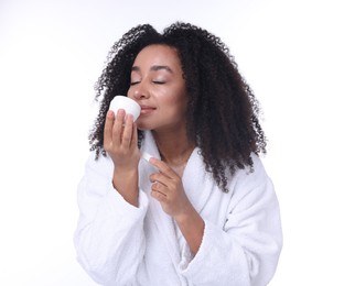 Photo of Beautiful Brazilian woman with jar of collagen cream on white background