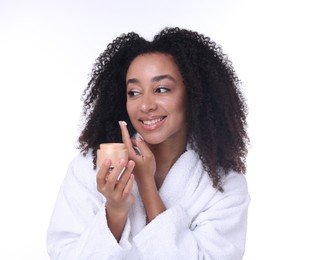 Photo of Beautiful Brazilian woman with jar of collagen cream on white background