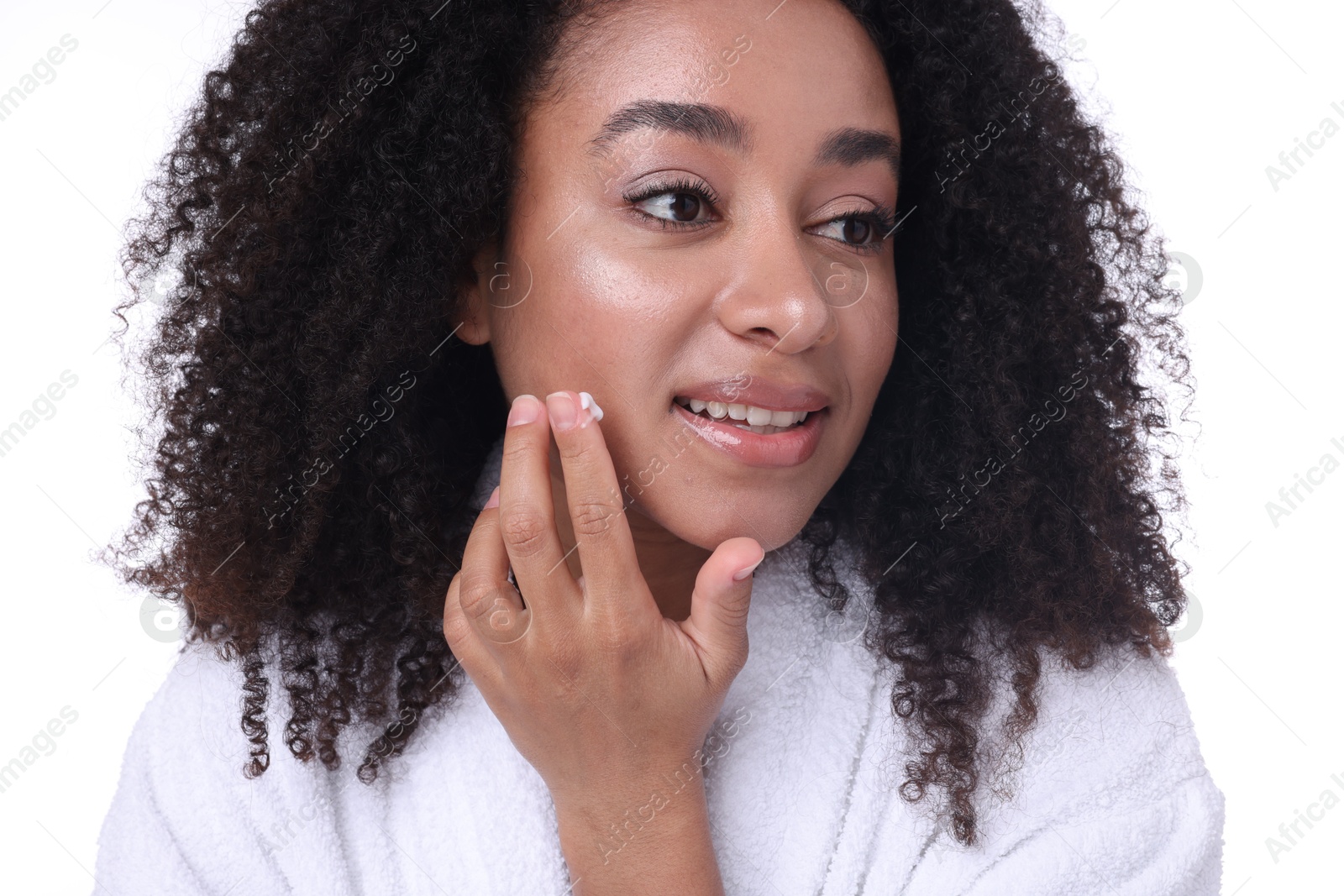 Beautiful Brazilian woman applying collagen cream on white background Photo of Beautiful Brazilian woman applying collagen cream on white background