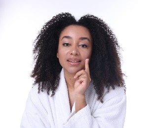 Photo of Beautiful Brazilian woman with collagen cream on white background