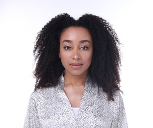 Photo of Beautiful Brazilian woman with healthy skin on white background