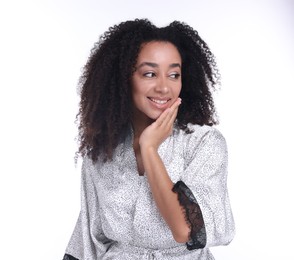 Photo of Beautiful Brazilian woman with healthy skin on white background