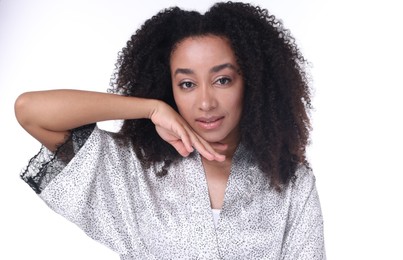 Photo of Beautiful Brazilian woman with healthy skin on white background
