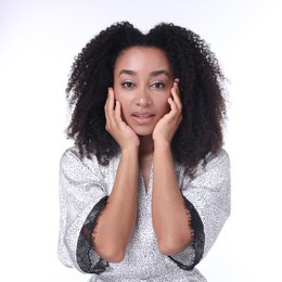 Photo of Beautiful Brazilian woman with healthy skin on white background