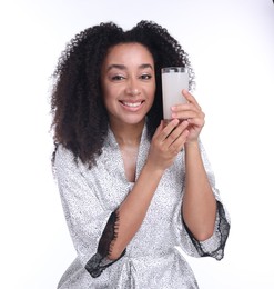 Photo of Beautiful Brazilian woman with glass of collagen water on white background