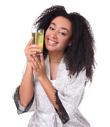 Photo of Beautiful Brazilian woman with glass of collagen water on white background