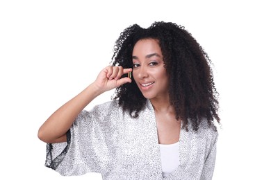 Photo of Beautiful Brazilian woman with collagen pill on white background