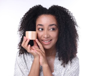 Photo of Beautiful Brazilian woman with jar of collagen cream on white background