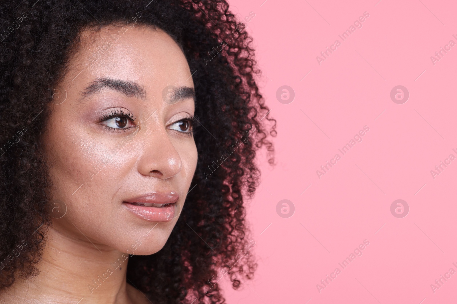 Beautiful Brazilian woman with healthy skin on pink background, closeup. Space for text Photo of Beautiful Brazilian woman with healthy skin on pink background, closeup. Space for text