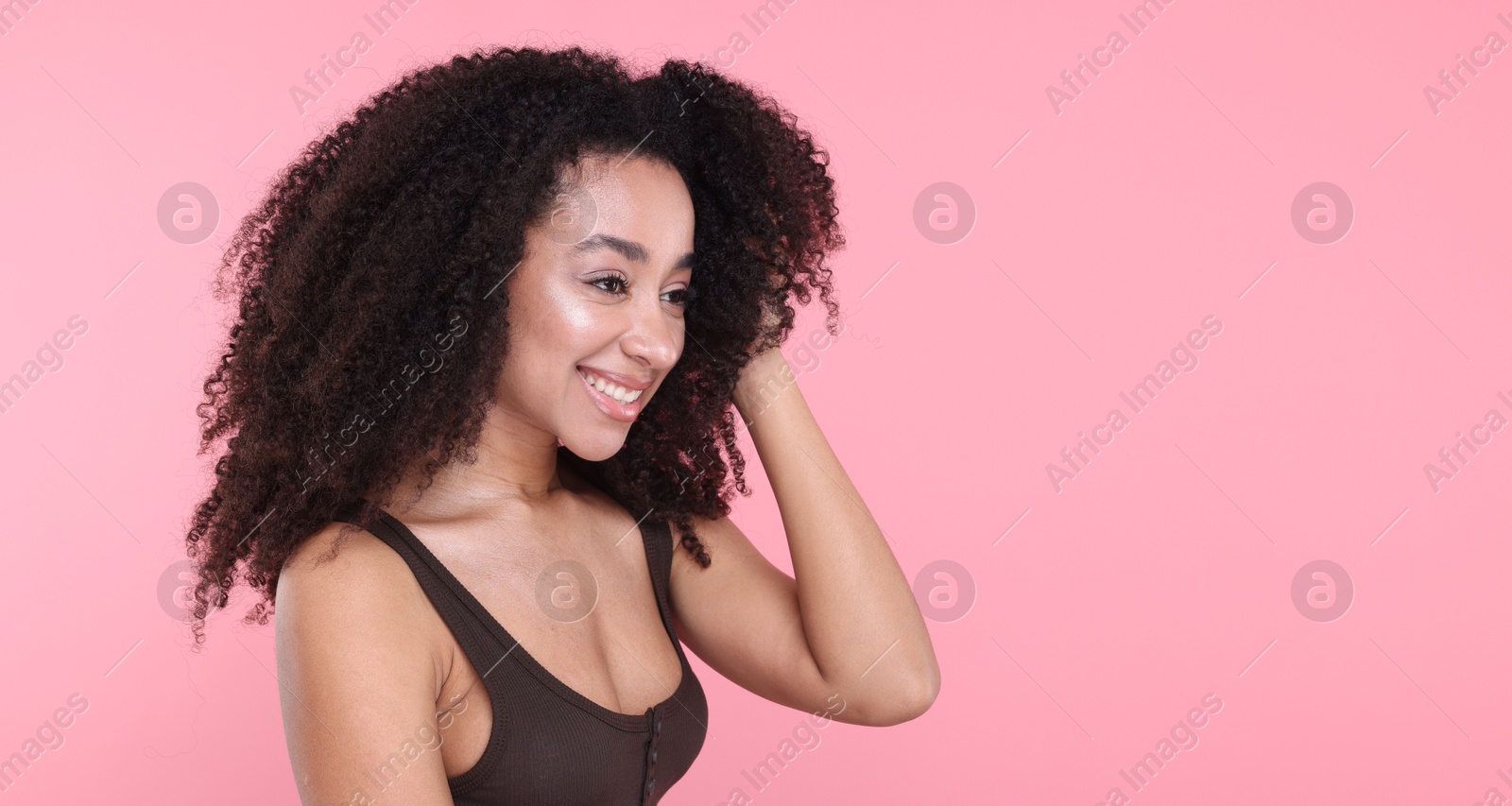 Beautiful Brazilian woman with healthy skin on pink background. Space for text Photo of Beautiful Brazilian woman with healthy skin on pink background. Space for text