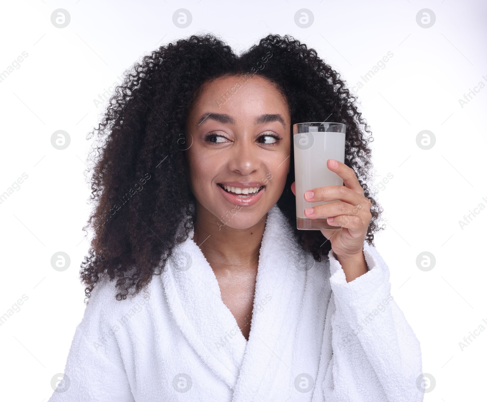Beautiful Brazilian woman with glass of collagen water on white background Photo of Beautiful Brazilian woman with glass of collagen water on white background