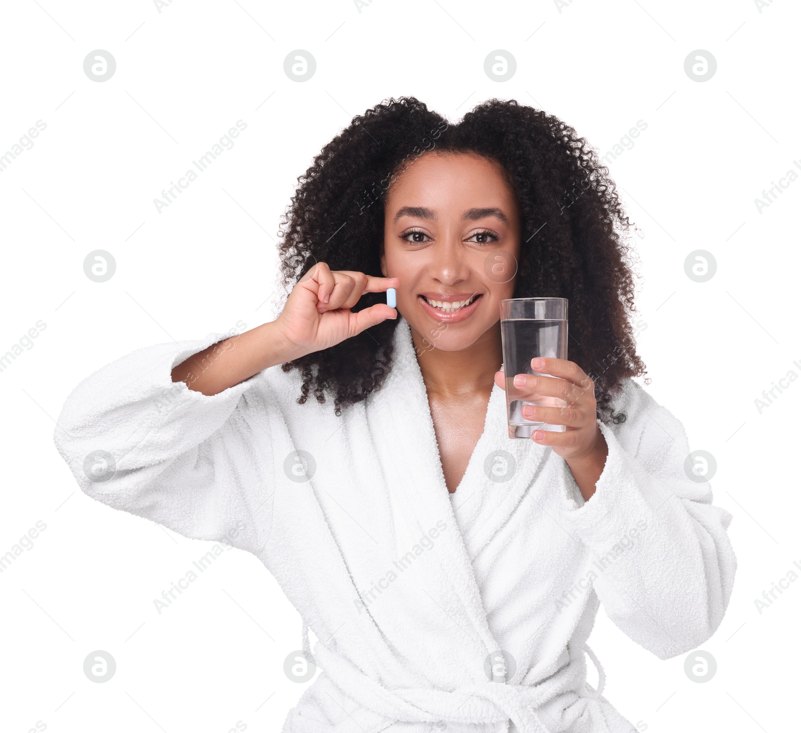 Beautiful Brazilian woman with glass of water and collagen pill on white background Photo of Beautiful Brazilian woman with glass of water and collagen pill on white background
