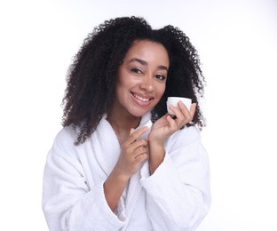 Photo of Beautiful Brazilian woman with jar of collagen cream on white background