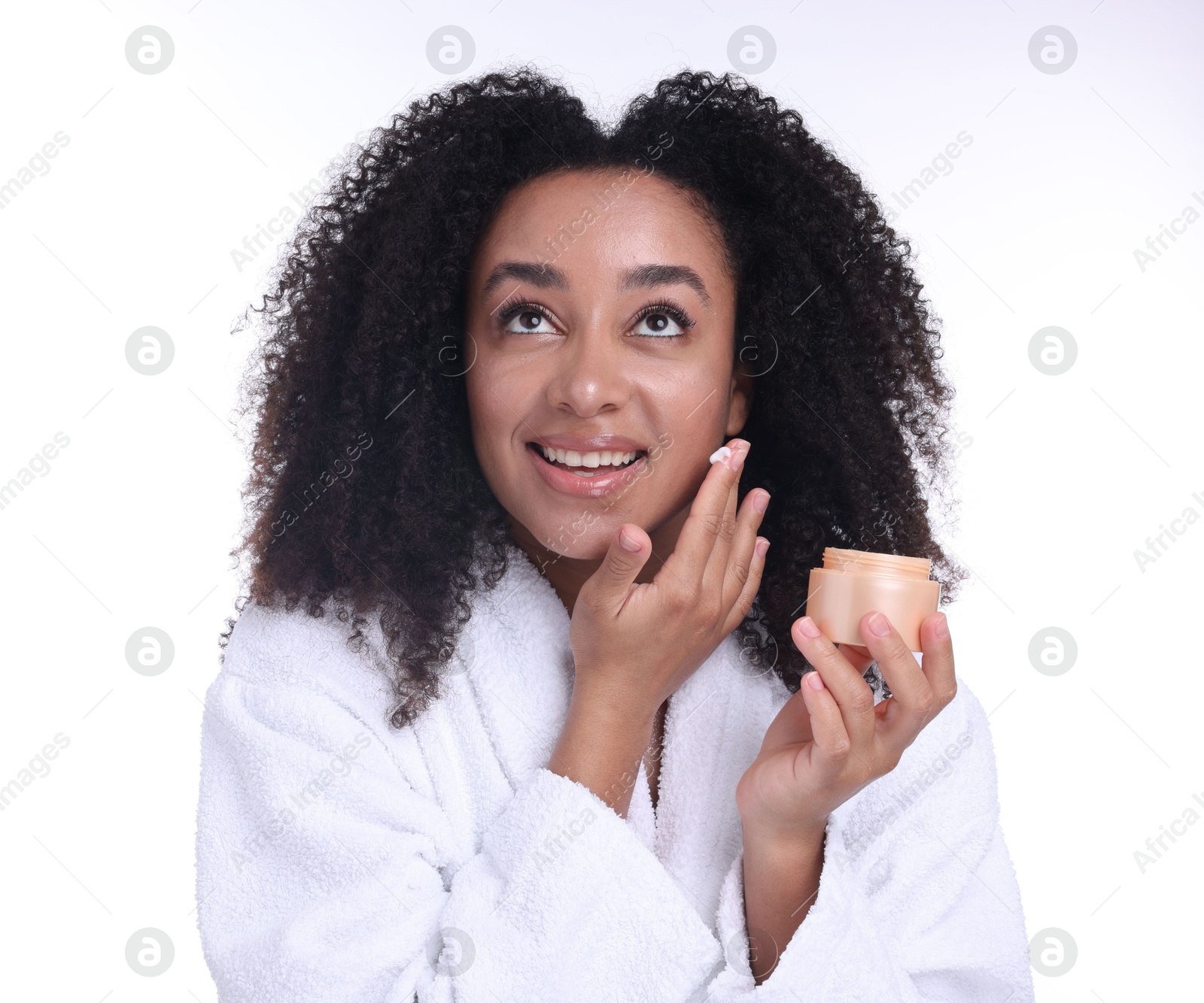 Beautiful Brazilian woman with jar of collagen cream on white background Photo of Beautiful Brazilian woman with jar of collagen cream on white background