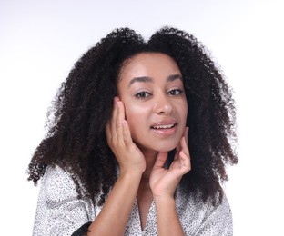 Photo of Beautiful Brazilian woman with healthy skin on white background