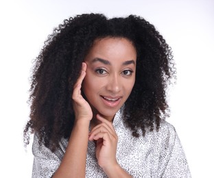 Photo of Beautiful Brazilian woman with healthy skin on white background