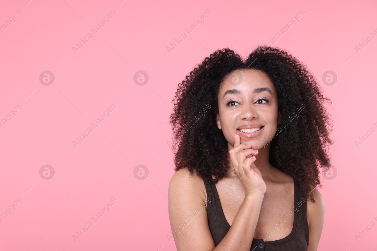 Beautiful Brazilian woman with healthy skin on pink background. Space for text Photo of Beautiful Brazilian woman with healthy skin on pink background. Space for text