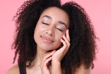 Photo of Beautiful Brazilian woman with healthy skin on pink background, closeup