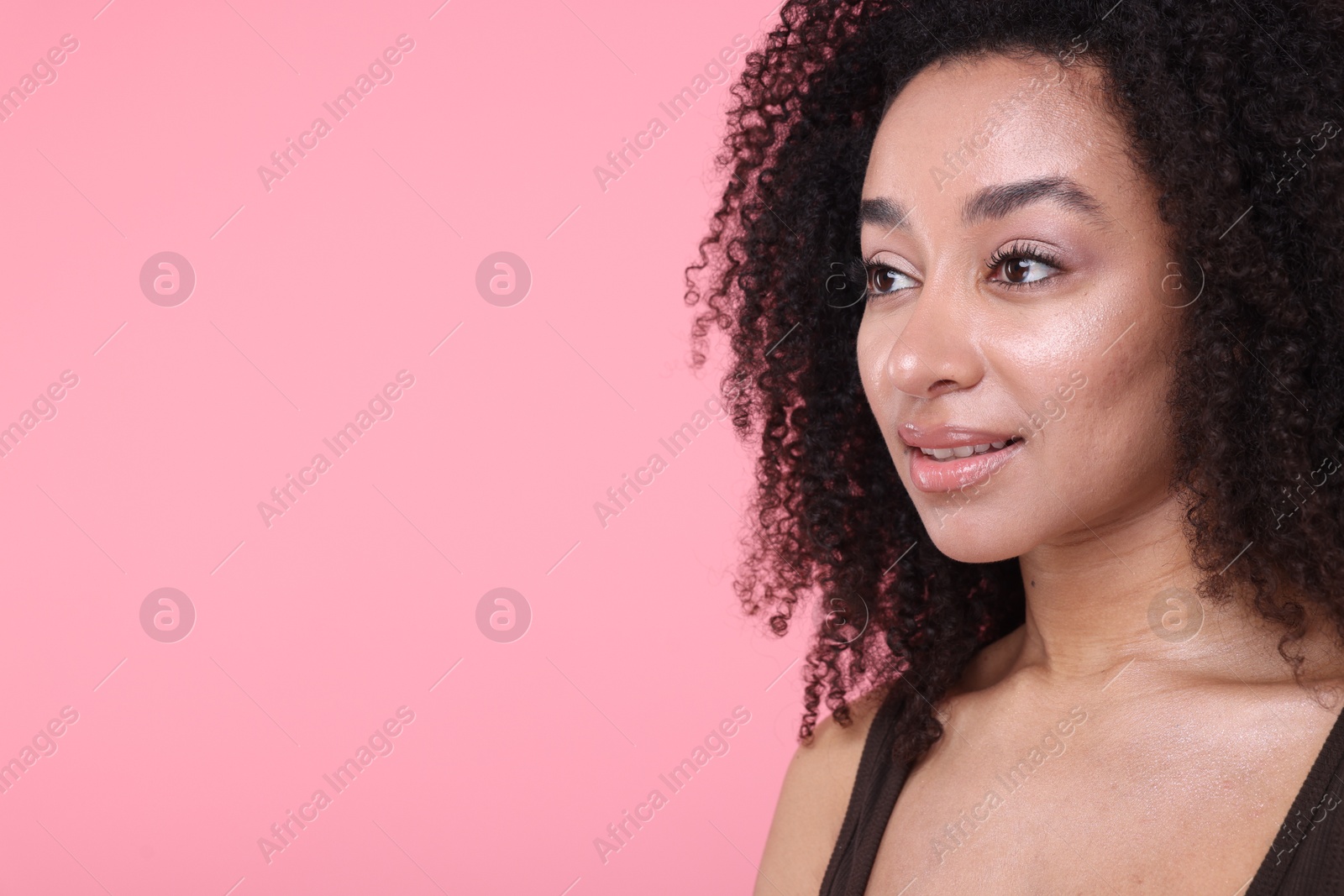 Beautiful Brazilian woman with healthy skin on pink background, closeup. Space for text Photo of Beautiful Brazilian woman with healthy skin on pink background, closeup. Space for text