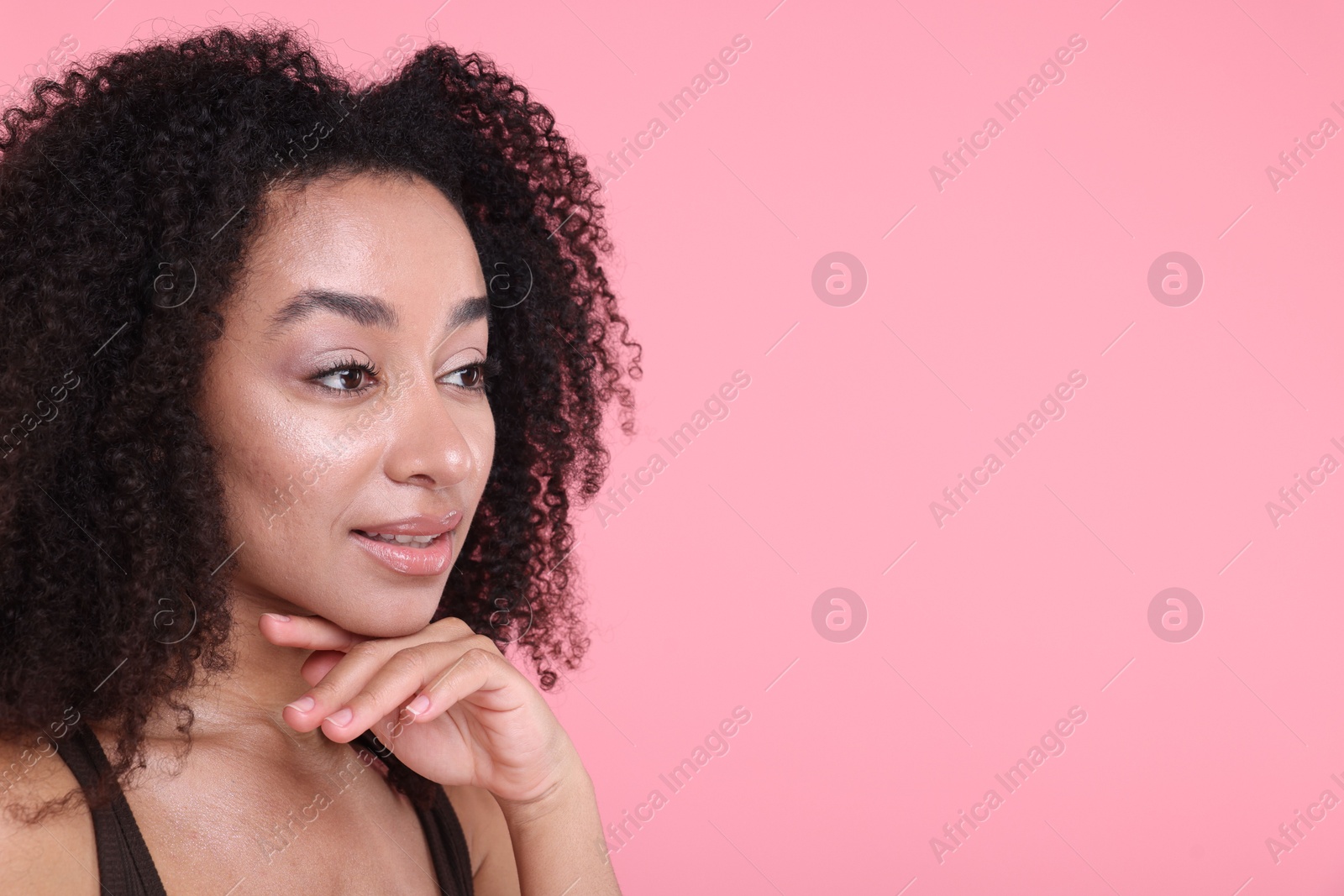 Beautiful Brazilian woman with healthy skin on pink background. Space for text Photo of Beautiful Brazilian woman with healthy skin on pink background. Space for text
