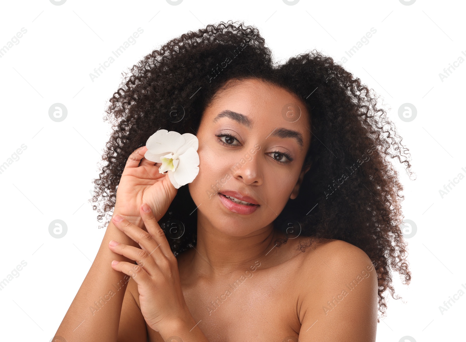 Portrait of beautiful Brazilian woman with orchid flower after spa treatment on white background Photo of Portrait of beautiful Brazilian woman with orchid flower after spa treatment on white background