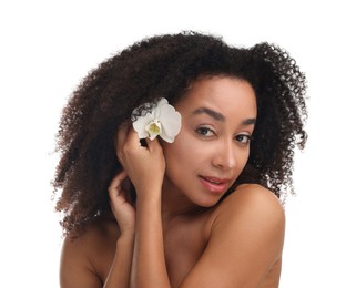 Photo of Portrait of beautiful Brazilian woman with orchid flower after spa treatment on white background