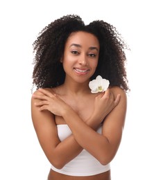 Photo of Portrait of beautiful Brazilian woman with orchid flower after spa treatment on white background