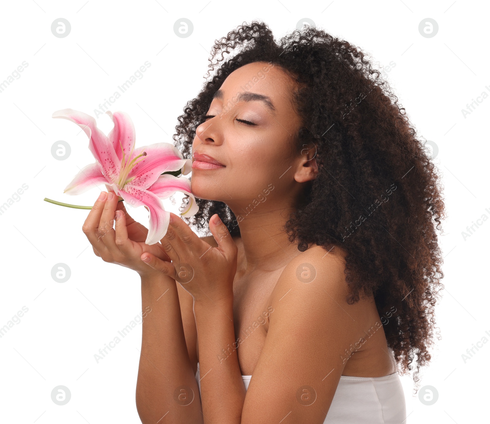 Portrait of beautiful Brazilian woman with lily flower after spa treatment on white background Photo of Portrait of beautiful Brazilian woman with lily flower after spa treatment on white background