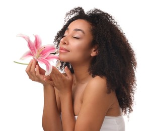 Photo of Portrait of beautiful Brazilian woman with lily flower after spa treatment on white background