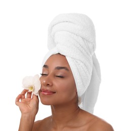 Photo of Portrait of beautiful Brazilian woman with orchid flower after spa treatment on white background