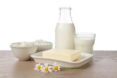 Photo of Different fresh dairy products and chamomile flowers on wooden table against white background