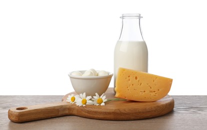 Photo of Different fresh dairy products and chamomile flowers on wooden table against white background
