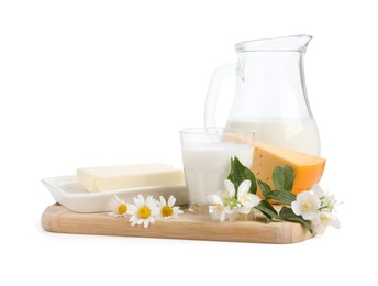 Photo of Different fresh dairy products and flowers isolated on white