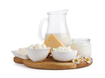 Photo of Different fresh dairy products and chamomile flowers isolated on white