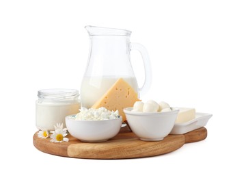 Photo of Different fresh dairy products and chamomile flowers isolated on white
