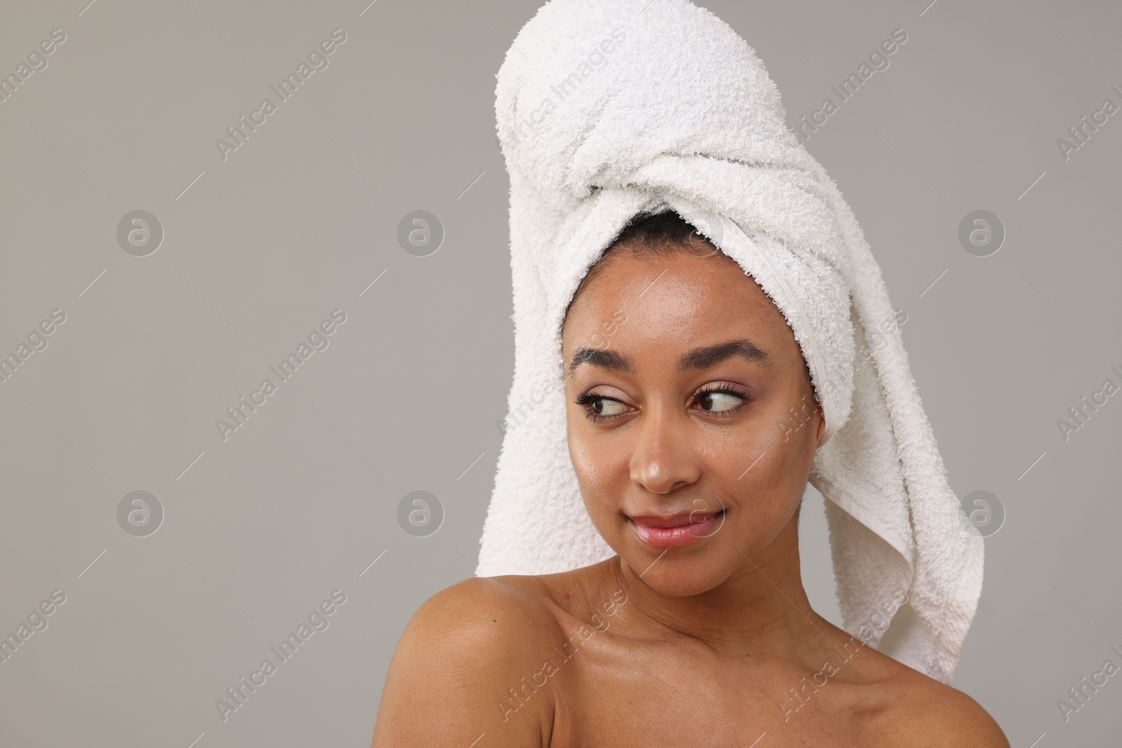 Portrait of beautiful Brazilian woman after spa treatment on gray background Photo of Portrait of beautiful Brazilian woman after spa treatment on gray background