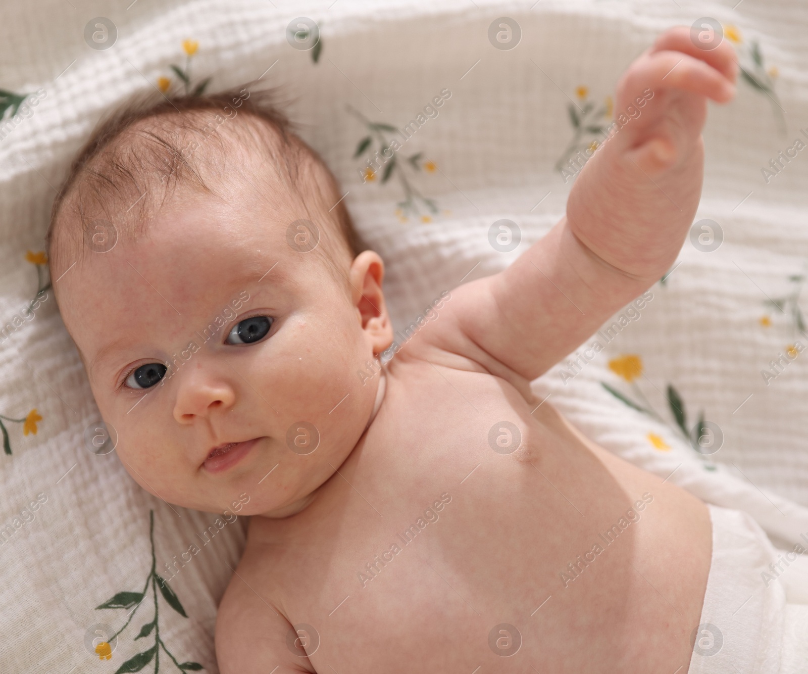 Cute newborn baby lying on bed, top view Photo of Cute newborn baby lying on bed, top view