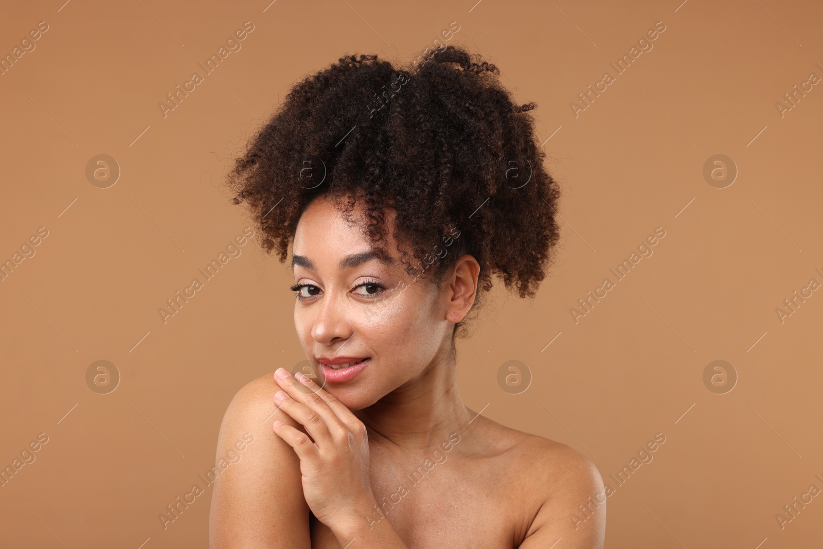 Portrait of beautiful Brazilian woman after spa treatment on light brown background Photo of Portrait of beautiful Brazilian woman after spa treatment on light brown background