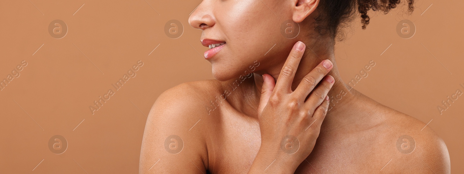 Brazilian woman after spa treatment on light brown background, closeup. Space for text Photo of Brazilian woman after spa treatment on light brown background, closeup. Space for text