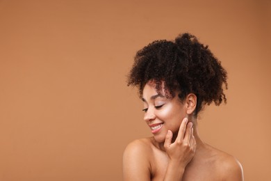 Photo of Portrait of beautiful Brazilian woman after spa treatment on light brown background. Space for text