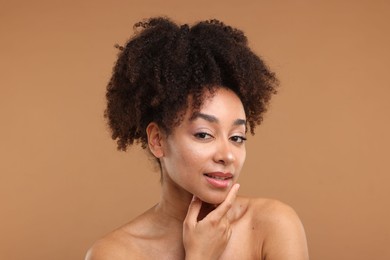 Photo of Portrait of beautiful Brazilian woman after spa treatment on light brown background